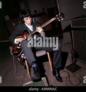 ROLLING STONES Bill Wyman tuning up before  group appeared on ABC TV's Thank Your Lucky Stars in November 1964. Photo Tony Gale Stock Photo