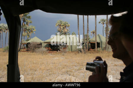 Safari tourist with camera Jack's Camp Botswana Africa Stock Photo