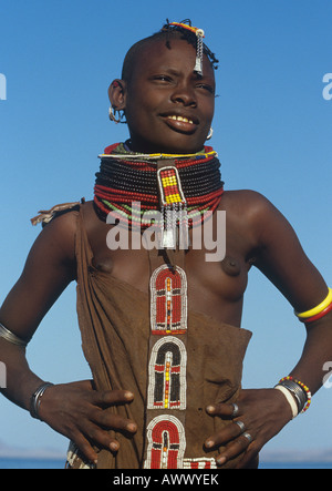 Turkana woman wearing many necklaces of brightly coloured beads by the shores of Lake Turkana in Northern Kenya Stock Photo