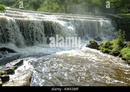 River Wye cascading over a weir in Monsal Dale, Derbyshire Stock Photo