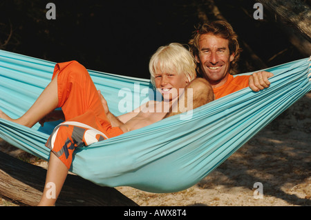 son and father in hammock Stock Photo