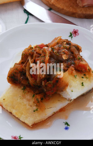 Dried salted cod ( cooked in the Livorno way ) Tuscan recipe italy - Italian Kitchen Stock Photo