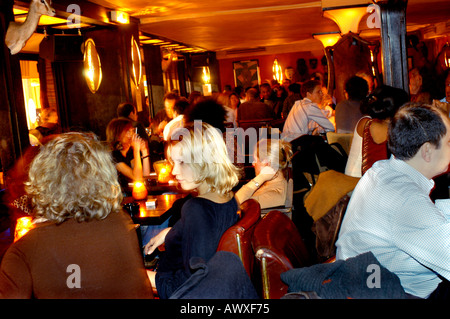 PARIS France, Crowd of People, Women in Dining Room, Af-rican Theme Bar Bistro Restaurant, 'L'Impala Lounge' Night Stock Photo