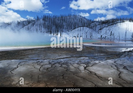 USA, Wyoming, Yellowstone National Park, Grand Prismatic Spring, mist over hot spring in winter landscape Stock Photo