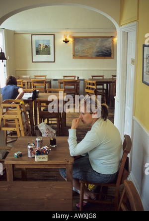 Woman In Coffee Shop At Aldeburgh in Suffolk Uk Stock Photo