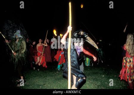 Druids dancing during the summer solstice at Avebury stone circle in bird costume Stock Photo