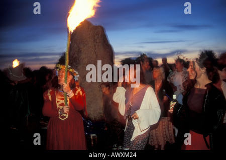 Druids dancing during the summer solstice at Avebury stone circle Stock Photo