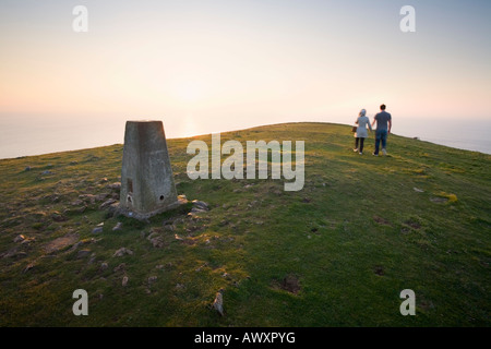 Couple Walking on Brean Down at Sunset Somerset England Stock Photo