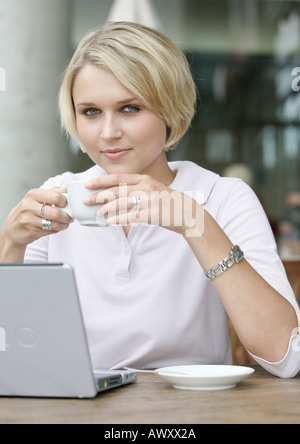 young business woman with laptop in a coffee shop Stock Photo