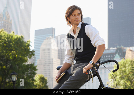 Man leaning on bicycle Stock Photo