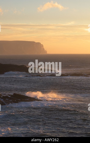 dh Qui Ayre YESNABY ORKNEY Waves breaking over rocks Hoy and sunset