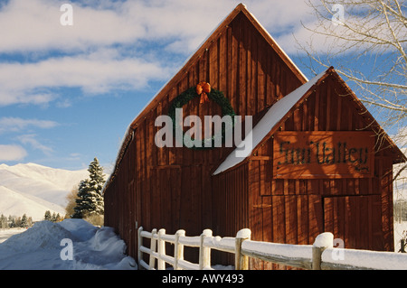 Idaho Sun Valley Red Barn Christmas wreath winter snow Stock Photo
