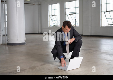 Businessman using Laptop Computer Stock Photo