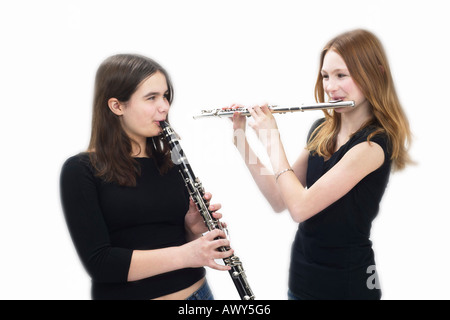 Teeenaged Girls Playing Flute and Clarinet Stock Photo