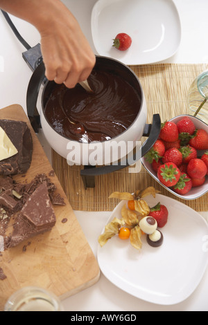 Woman Eating Chocolate Fondue Stock Photo