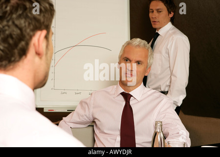 Three businessmen having a meeting Stock Photo