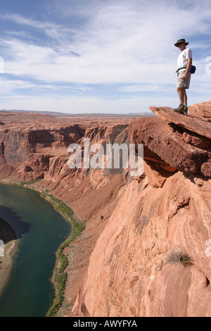 Hiker Overlooking Colorado river in Grand Canyon, Page, Arizona, USA Stock Photo