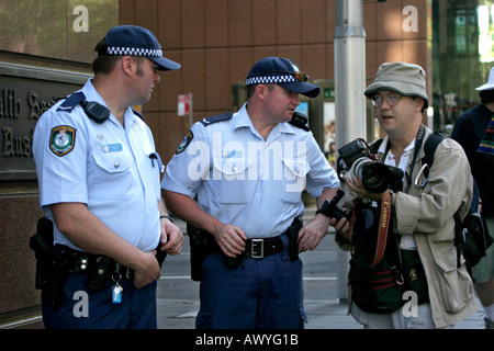 Members of the New South Wales Police force with news photographer