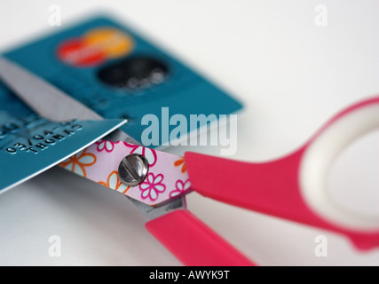 Credit Card being cut up with scissors Stock Photo