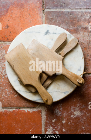 Butter shapers also known as Scotch hands for making pats on the quarry tiled floor of the Living Room at Rosedene Stock Photo