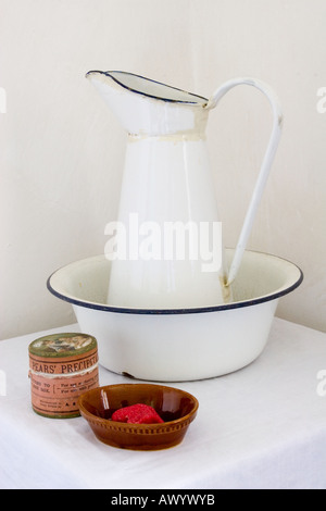 Enamel washing jug & bowl and soap in the bedroom at Rosedene the cottage in which early Chartists lived first occupied in 1849 Stock Photo