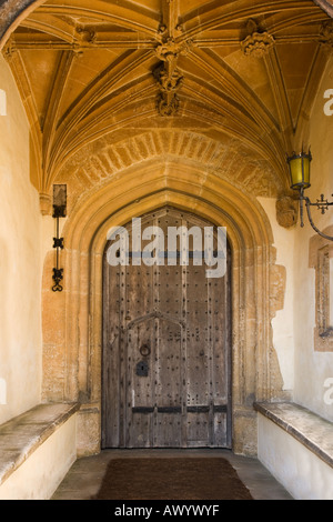 Entrance Porch in the north front of the C15th Great Chalfield Manor Wiltshire The ancient door is of double oak Stock Photo