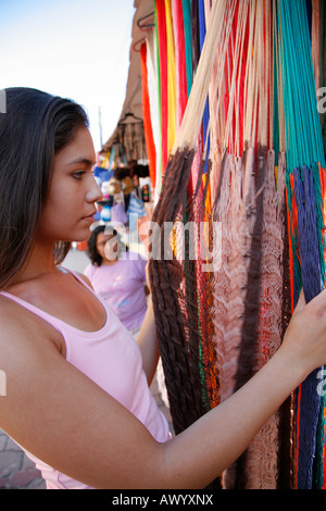 Young woman shopping hammock, souvenir shop, Isla Mujeres, Cancun, Mexico. MR-03-05-2008 Stock Photo