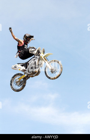 Premium Vector, Motocross rider doing jumping whip trick