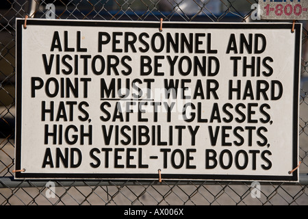 Safety sign on the perimeter fence of an American building site. Stock Photo
