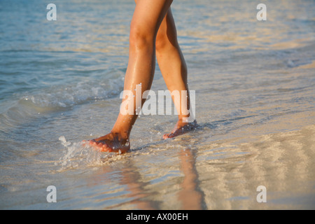 Young woman walking on a street, Isla Mujeres, Cancun, Mexico. MR-03-03-2008-2 Stock Photo