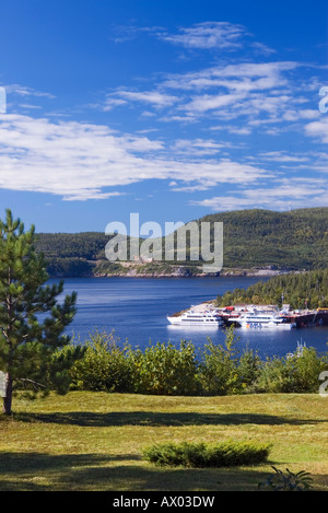 Tadoussac Bay and Saguenay river estuary with whale watching cruising ships at port Stock Photo