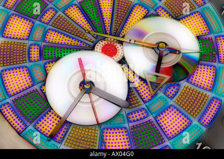 CD with Clock Hands on  Dartboard Stock Photo
