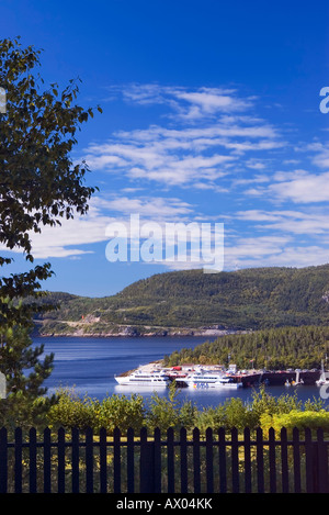 Tadoussac Bay and Saguenay river estuary with whale watching cruising ships at port Stock Photo