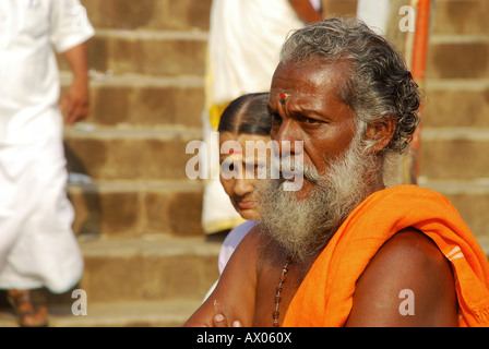 An indian poojari and his wife standing in frint of pdmanabha temple trevandrum before the attukalPONGALA Stock Photo