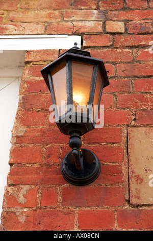 An old style light fixture on the wall. Stock Photo