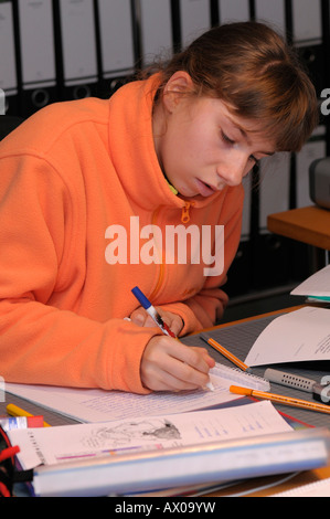 Girl doing homework Stock Photo