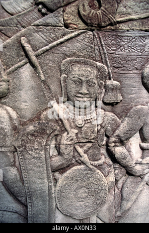 Carvings on the outer walls of the Bayon depicting scenes of daily life and ritual Angkor Thom Bayon Beside Angkor Wat Cambodia Stock Photo