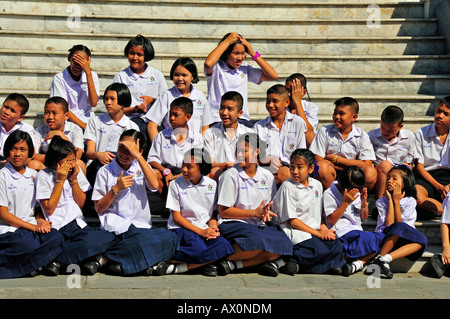 School class in Wat Phra Kaeo Grand Palace (Temple of the Emerald Buddha), Bangkok, Thailand, Southeast Asia, Asia Stock Photo