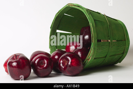 Green bushel of red apples Stock Photo