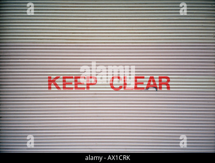 Keep Clear sign on a garage door Stock Photo