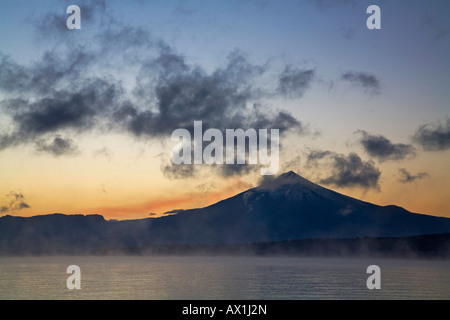 Sunrise at Vulcano Villarrica at the lake Lago Villarrica, Chile, South America Stock Photo