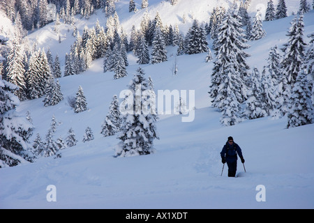 Snowshoer at Mt. Schildenstin near Tegernsee lake in Bavaria, Germany, Europe Stock Photo