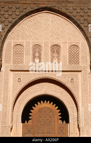 Oriental portal made of cedar wood with fine stucco richly decorated Medersa Ali Ben Youssef medina Marrakech Morocco Stock Photo