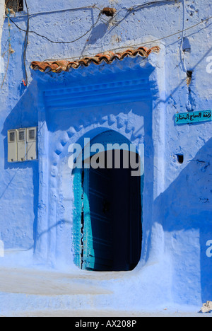 Luminous blue gate medina Chefchaouen Morocco Stock Photo