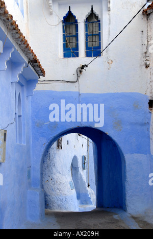 Luminous blue painted gate medina Chefchaouen Morocco Stock Photo