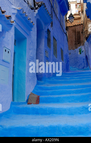 Luminous blue painted steep alley with stairs medina Chefchaouen Morocco Stock Photo