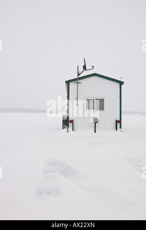 AN ICE FISHING HOUSE EQUIPED WITH A TV SATELITE ON LEECH LAKE MINNESOTA ...