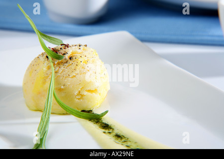 White chocolate pepper and saffron ice cream with its sauce Stock Photo