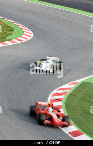 Formula 1 Racecar speeds through double bend curve in racetrack Stock ...