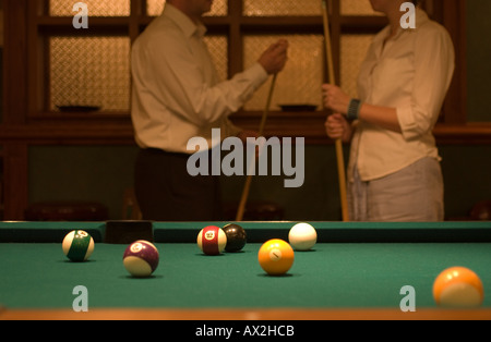 couple by pool table Stock Photo